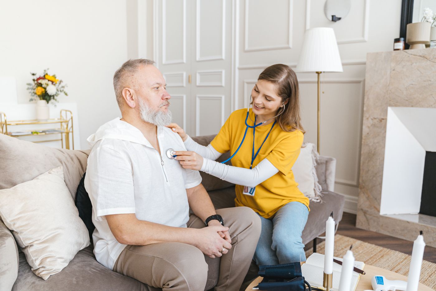 Carer chatting with a client in his living room